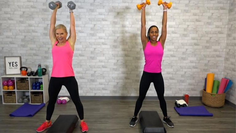 Two women lifting dumbbells