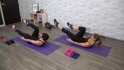 Two women doing an ab workout