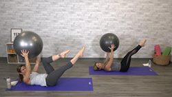 Two women doing pilates with a stability ball