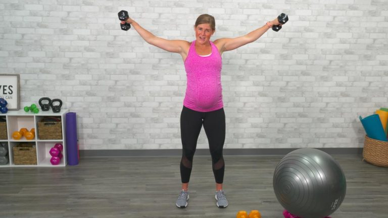 Pregnant women working out with dumbbells