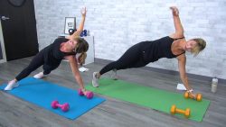 Two women doing side plank reach throughs