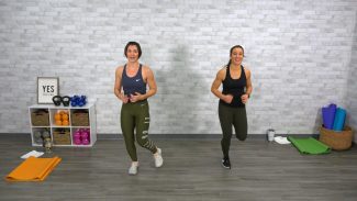 Two women doing a cardio class
