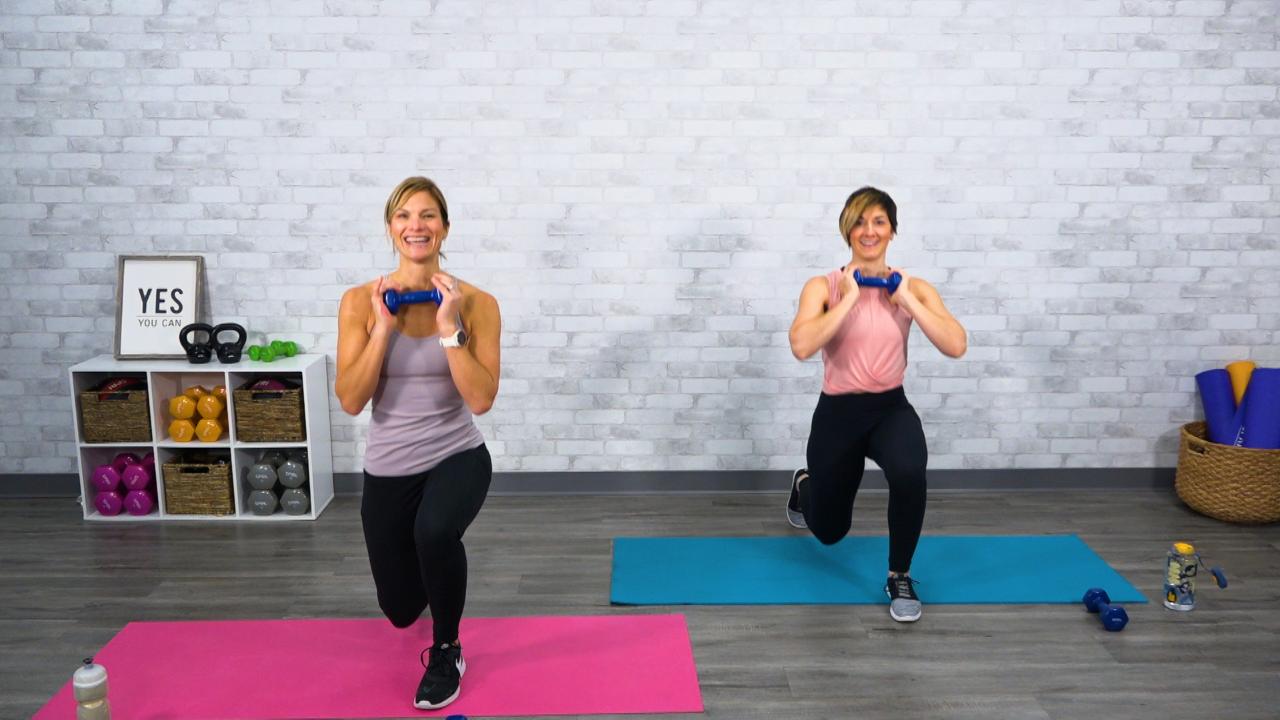 Two women doing lunches with small dumbbells