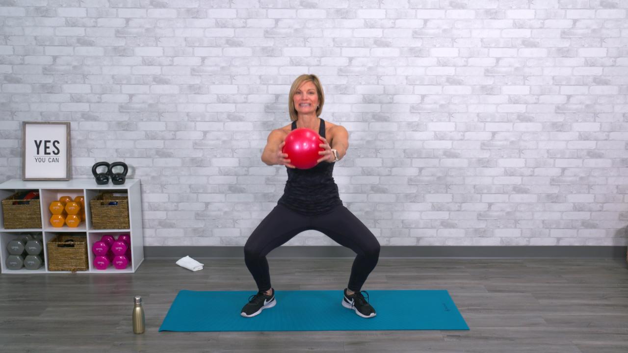 Woman doing a workout with a ball