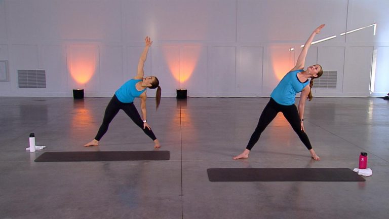 Two women doing inverted triangle poses