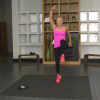 Woman in a pink tank top doing a workout