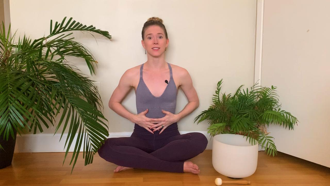 Women with her hands on her belly meditating
