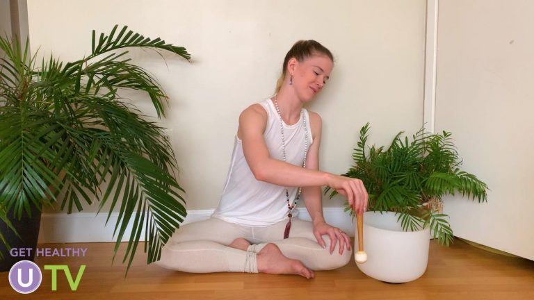 Woman meditating with a sound bowl