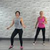 Two women doing a cardio dance workout