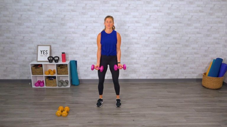Woman doing bicep curls with pink dumbbells