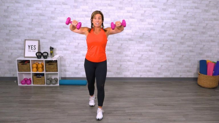Woman in an orange tank top working out with pink dumbbells