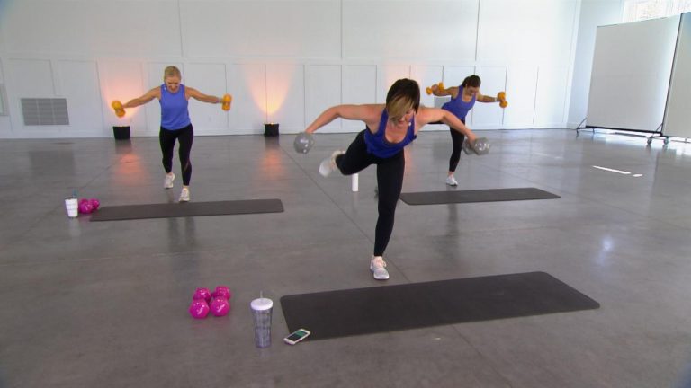 Three women doing lateral flies with dumbbells
