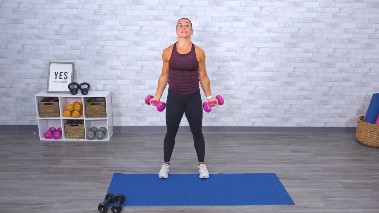 Woman working out with pink dumbbells