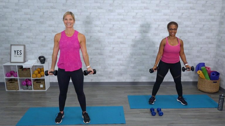 Two women in pink tank tops working out with dumbbells
