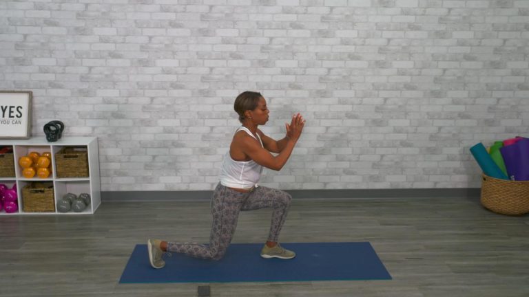 Woman doing a lunge on an exercise mat