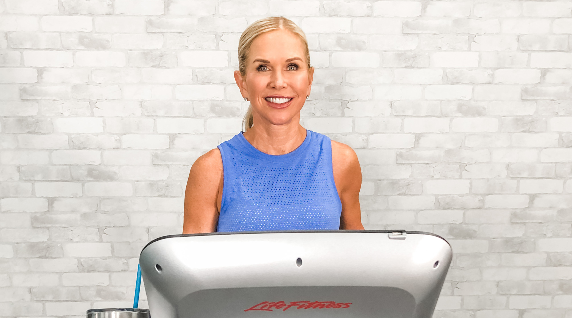 Woman posing on a treadmill