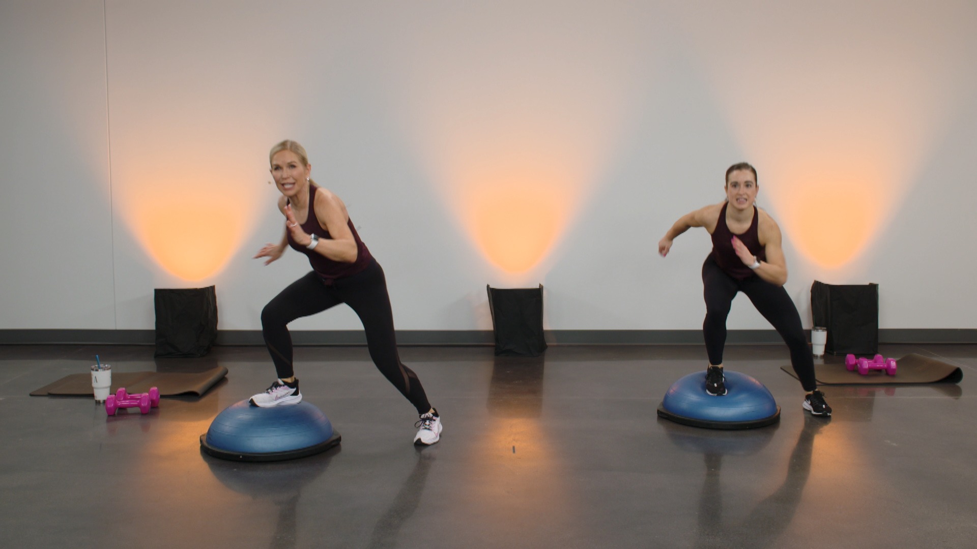 Two women working out on BOSU balls