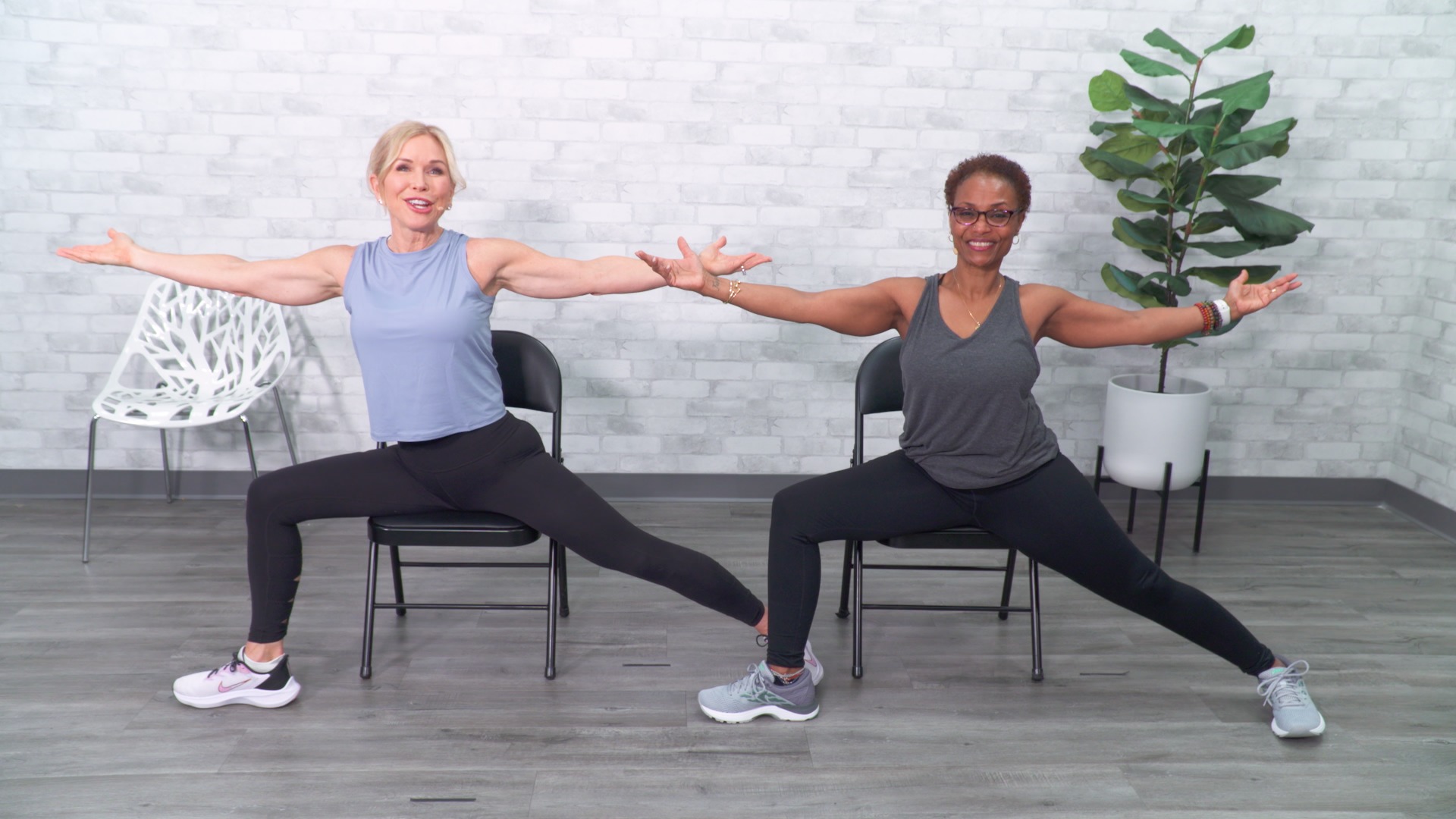Two women doing a chair workout