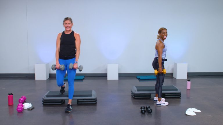 Two women working out with weights and a step