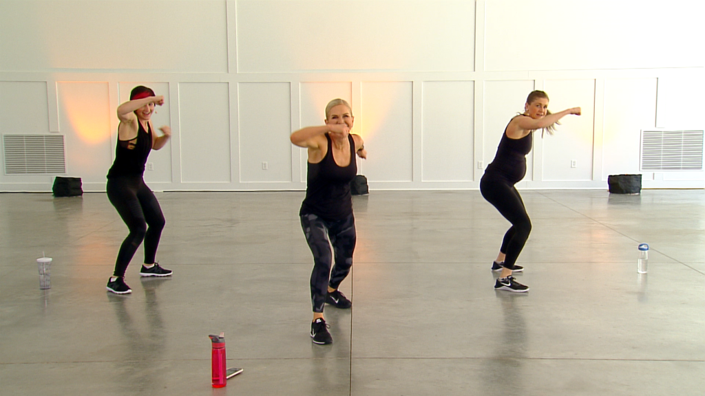 Three women kickboxing