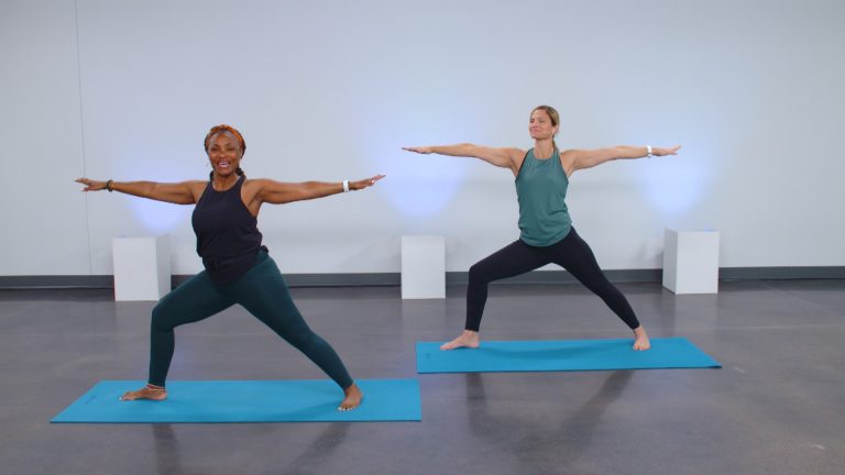 Two women doing a yoga pose