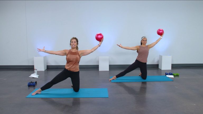 Two women working out with barre balls