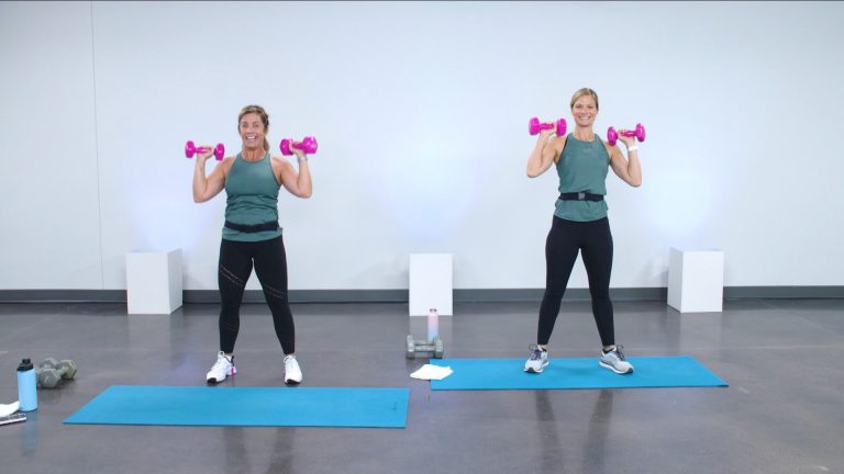 Two women working out with pink dumbbells