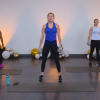 Women working out with dumbbells in a room with balloons