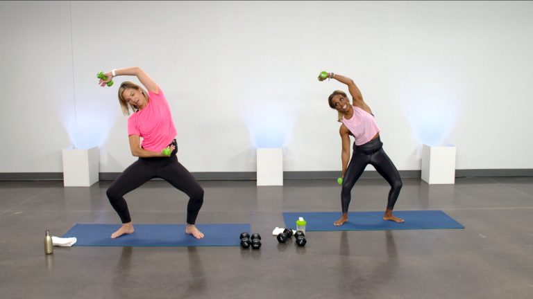 Two women doing a workout with small dumbbells