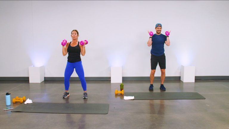 Two people working out with pink dumbbells