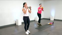 Man and woman working out with dumbbells