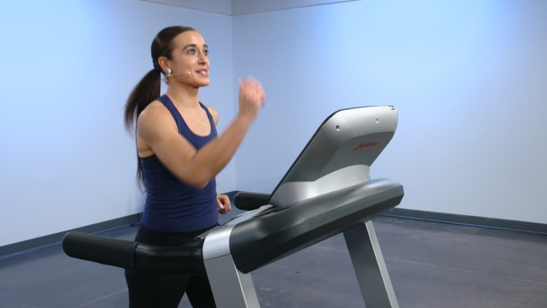 Woman working out in a treadmill
