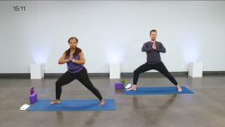 Man and a woman doing a yoga class