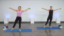 Two women during barre with small dumbbells