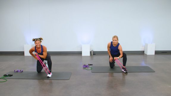 Two women working out with mini bands
