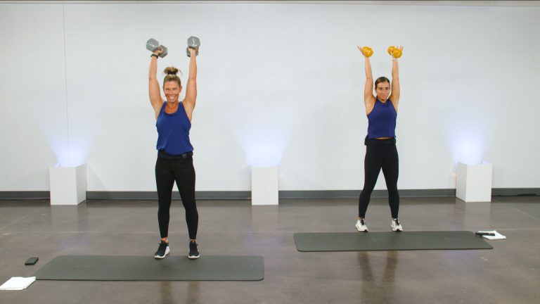 Two women doing narrow shoulder presses with weights