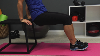 Woman doing a tricep dip on a step