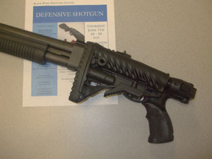 Remington 870 with FAB Defense stock image