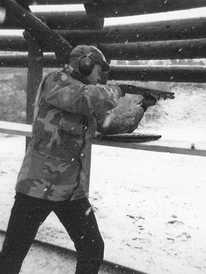 The author shooting a Mossberg M590 shotgun - Home Defense Shotguns