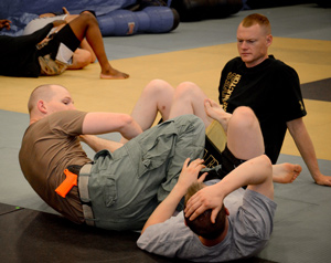 Image of three men showing ccw grappling