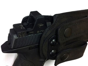 Image of pistol fitting in holster