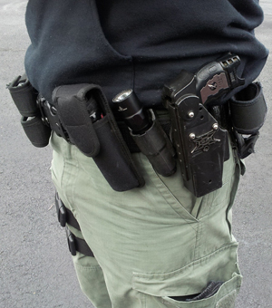 Image of a person wearing a belt full of essential gear