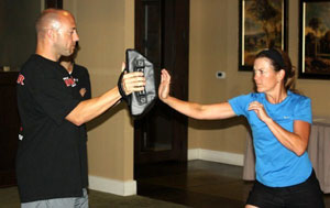 image of a woman practicing basic self defense techniques