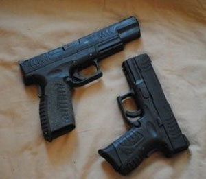 image of two guns