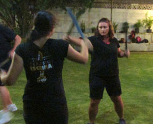 This is an image of two women practicing self defense
