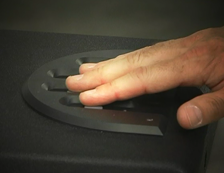 Hand on a fingerprint scanner