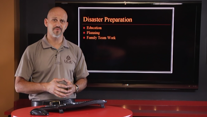 Man with a keyboard and a disaster preparation slideshow