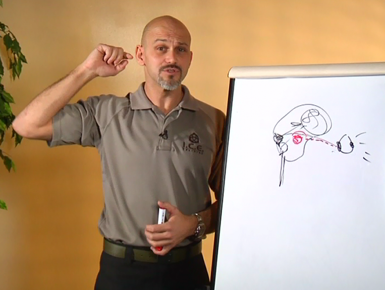 Man near a white board with a picture drawn