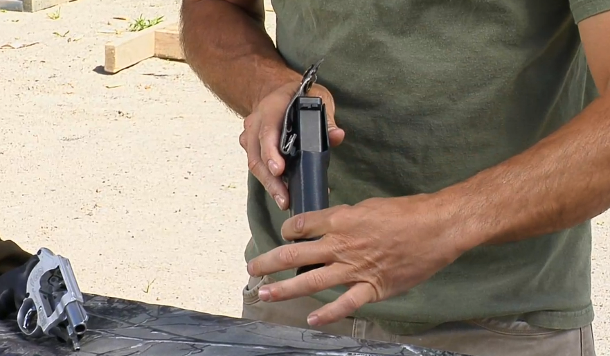 Man holding a gun pointed down