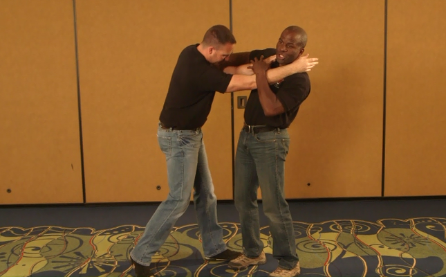 Two men practicing self-defense
